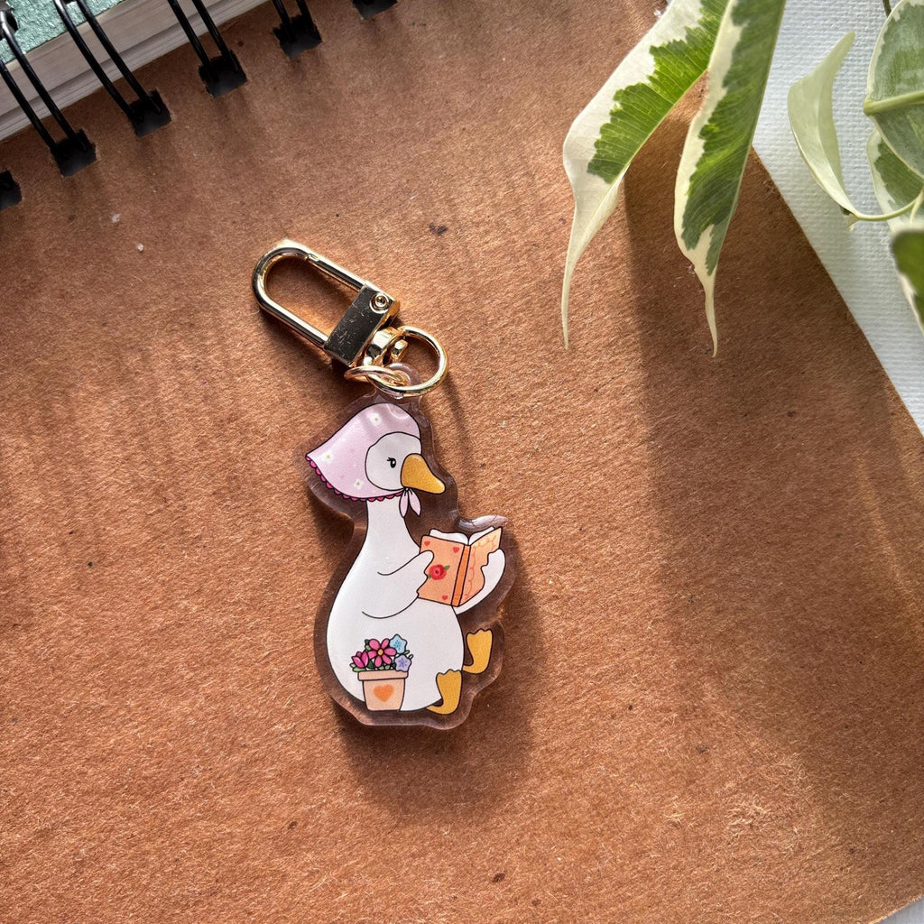 Cozy goose reading Acrylic Keychain
