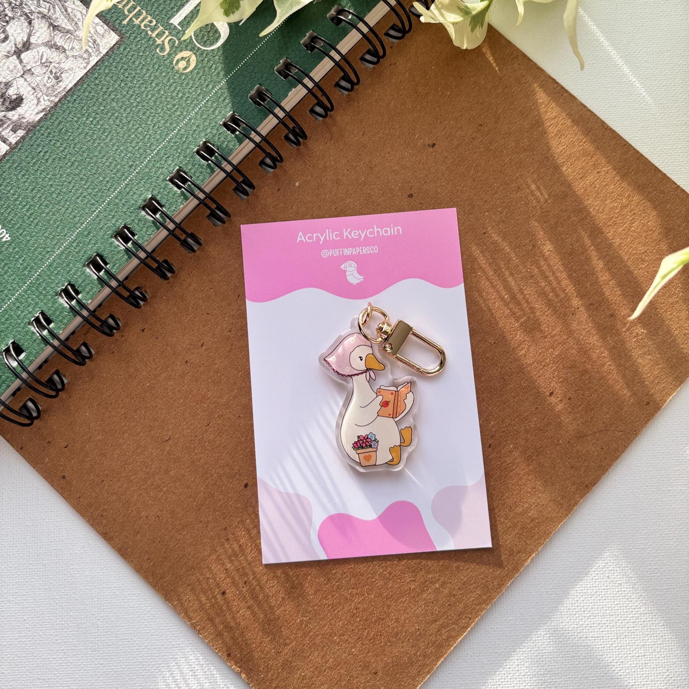 Cozy goose reading Acrylic Keychain