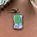 Cozy Frog Reading Acrylic Keychain