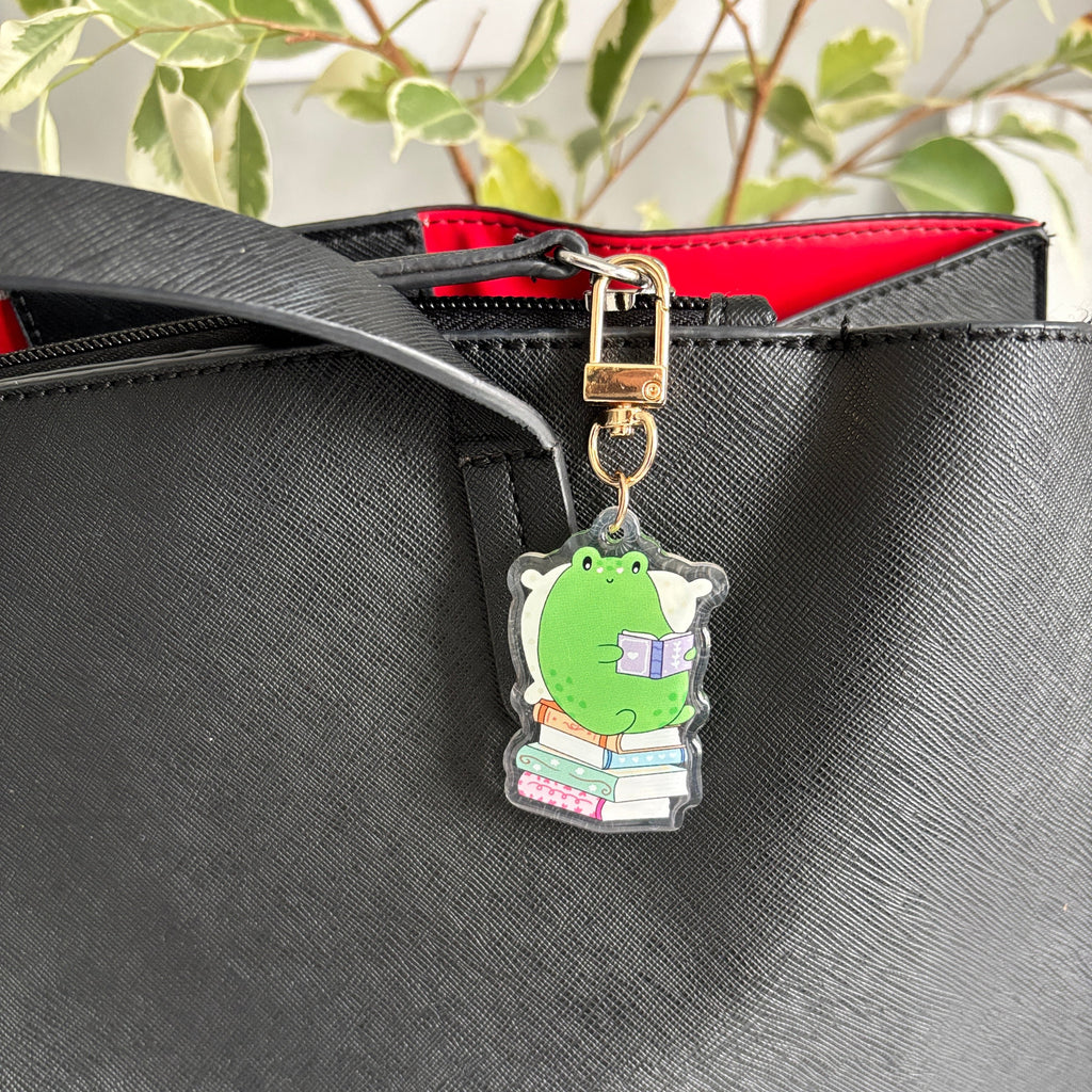 Cozy Frog Reading Acrylic Keychain